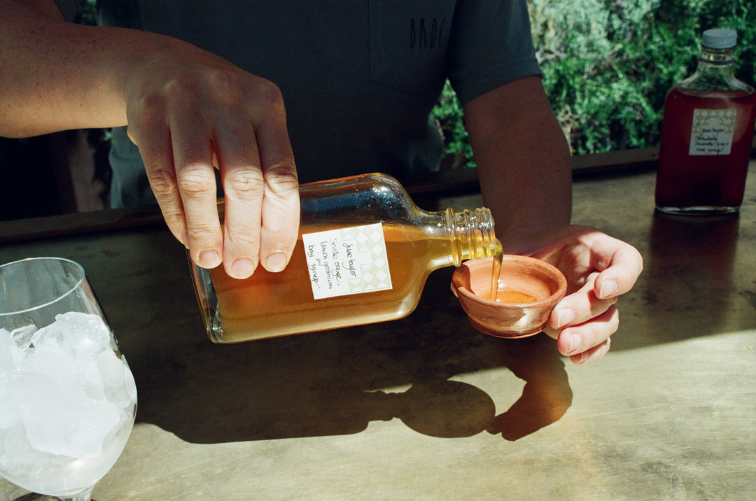 A person pours Broc Cellars&