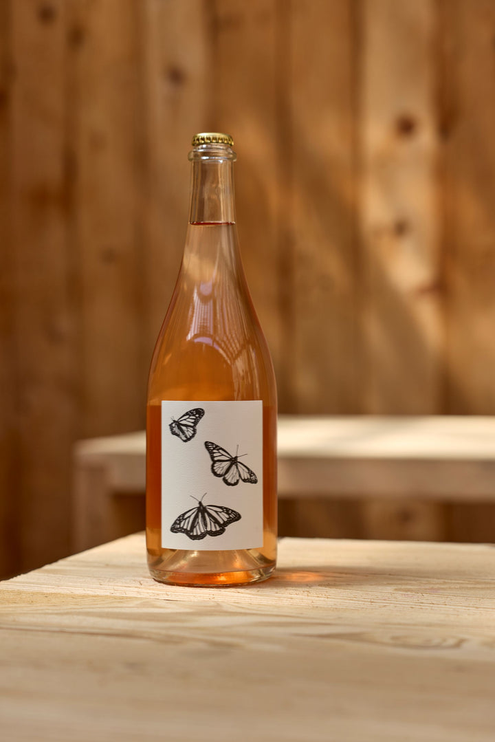 A clear glass bottle of Broc Cellars&
