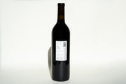 A tall, dark wine bottle labeled 2023 Cali Cab by Broc Cellars stands against a plain white background. Made with organic California grapes, the Cabernet Sauvignon casts a soft shadow leftward, promising rich allure within.