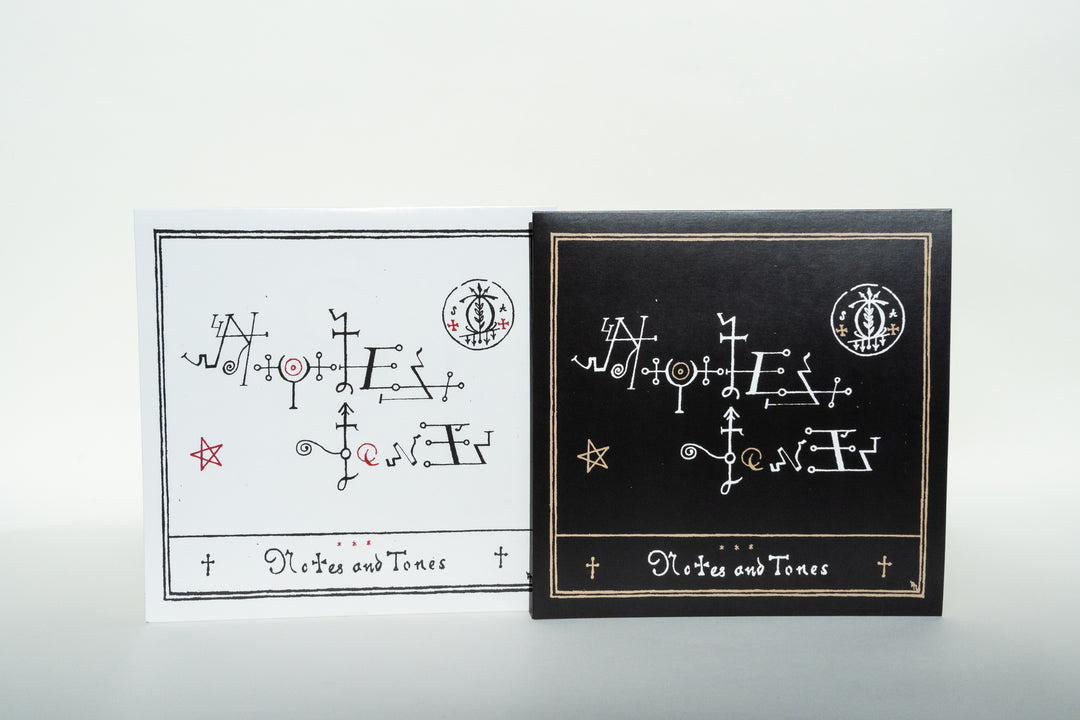Two square cards from Broc Cellars, showcasing abstract designs: left card is white with black and red, right card is black with white. Both feature Notes &amp; Tones in a decorative font, echoing the Soul Assassins’ collaboration style. Product: Notes &amp; Tones V.1 + V.2 - Album Duo.