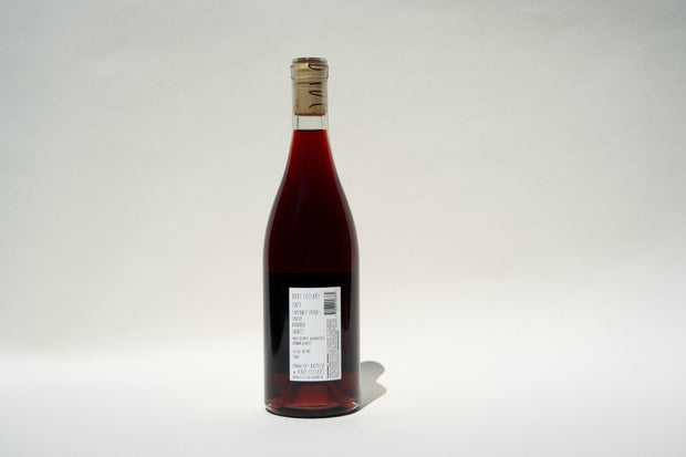 The 2023 KouKou Cabernet Franc by Broc Cellars, crafted from organic grapes and sealed with a cork, is showcased against a white backdrop. The deep red wine displays its label and barcode prominently on the front.