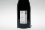 The image displays the back of a Broc Cellars 2023 Lagrein Red wine bottle with a white label detailing vineyard, vintage year, region, and alcohol content. It includes organic credentials and a barcode on the right.