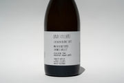 The minimalist white label reads: Broc Cellars, 2023 Happī Chenin, with alcohol and production details stating it is crafted and bottled by Broc Cellars in Berkeley, California.