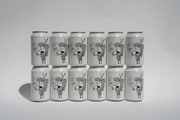 Twelve Got Grapes Red Cans from Broc Cellars are arranged in two rows of six. Each sleek can features a black and white abstract illustration with “CAN CRAFT” on the front, standing out against a plain white background—coming soon.