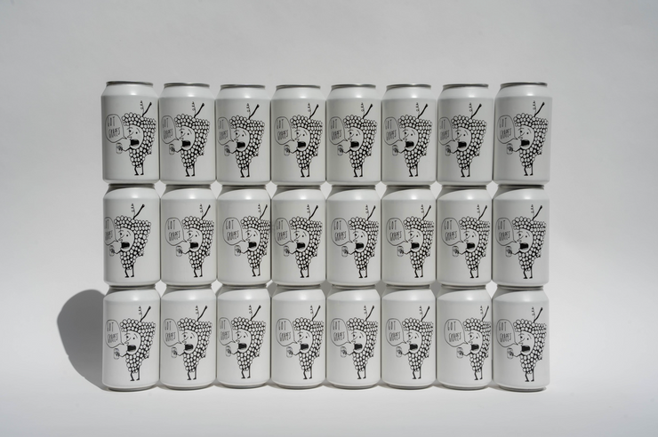 Twenty Got Grapes Red Cans from Broc Cellars are arranged in four rows of five against a plain background. Each can features a black and white geometric abstract illustration with a face on the front—coming soon.
