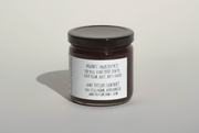 A glass jar of June Taylor x Fox Hill Santa Rosa Plum w/ Bay jam by Broc Cellars features a white label listing organic ingredients and low sugar. Handmade in Oakland, CA, it includes a website for more info.