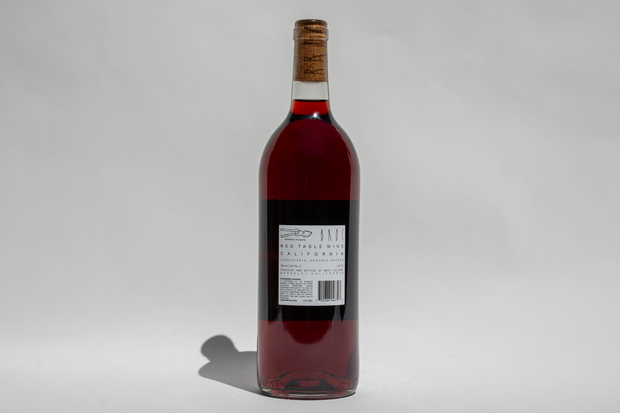 A bottle of 2024 La Boutanche red wine from Broc Cellars stands upright against a plain white background. The California wine bottle label is visible, displaying text, a barcode, and graphic elements.