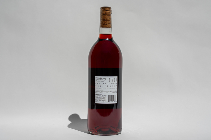 A bottle of 2024 La Boutanche red wine from Broc Cellars stands upright against a plain white background. The California wine bottle label is visible, displaying text, a barcode, and graphic elements.