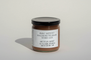 A small glass jar with a black lid contains Broc Cellars’ June Taylor Fox Hill Pear, Lemon Geranium, and Rosemary Preserve, made in small batches with organic ingredients. The white label notes: June Taylor Company, Oakland, CA.