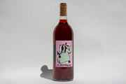A bottle of Broc Cellars 2024 La Boutanche Sangiovese from Fox Hill Vineyard, with a cork top and a label showing a cartoon badger holding a wine bottle and glass above the La Boutanche text, set against a plain white background.