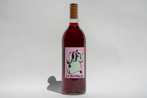 A bottle of Broc Cellars 2024 La Boutanche Sangiovese from Fox Hill Vineyard, with a cork top and a label showing a cartoon badger holding a wine bottle and glass above the La Boutanche text, set against a plain white background.