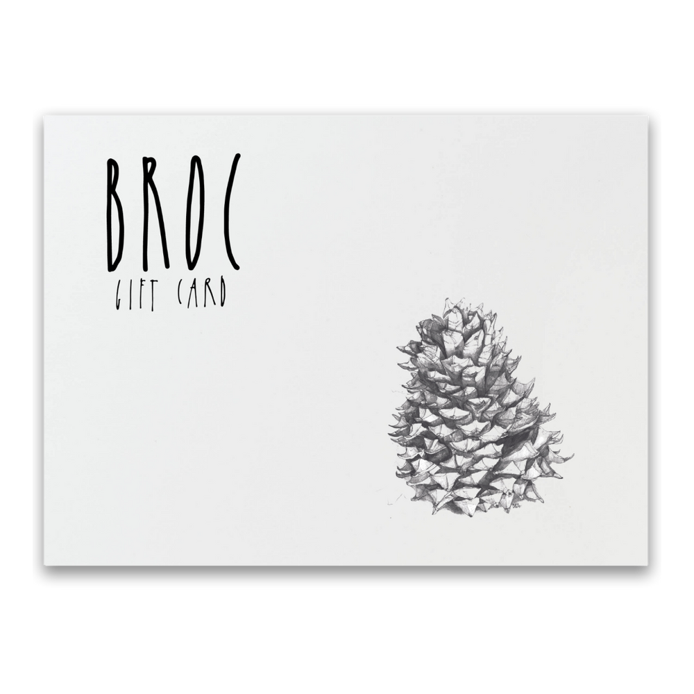 The Broc Gift Card from Broc Cellars features BROC in stylized black letters on a white background, labeled as GIFT CARD, and adorned with an elegant black and white pencil drawing of a pine cone, making it perfect for online shopping.