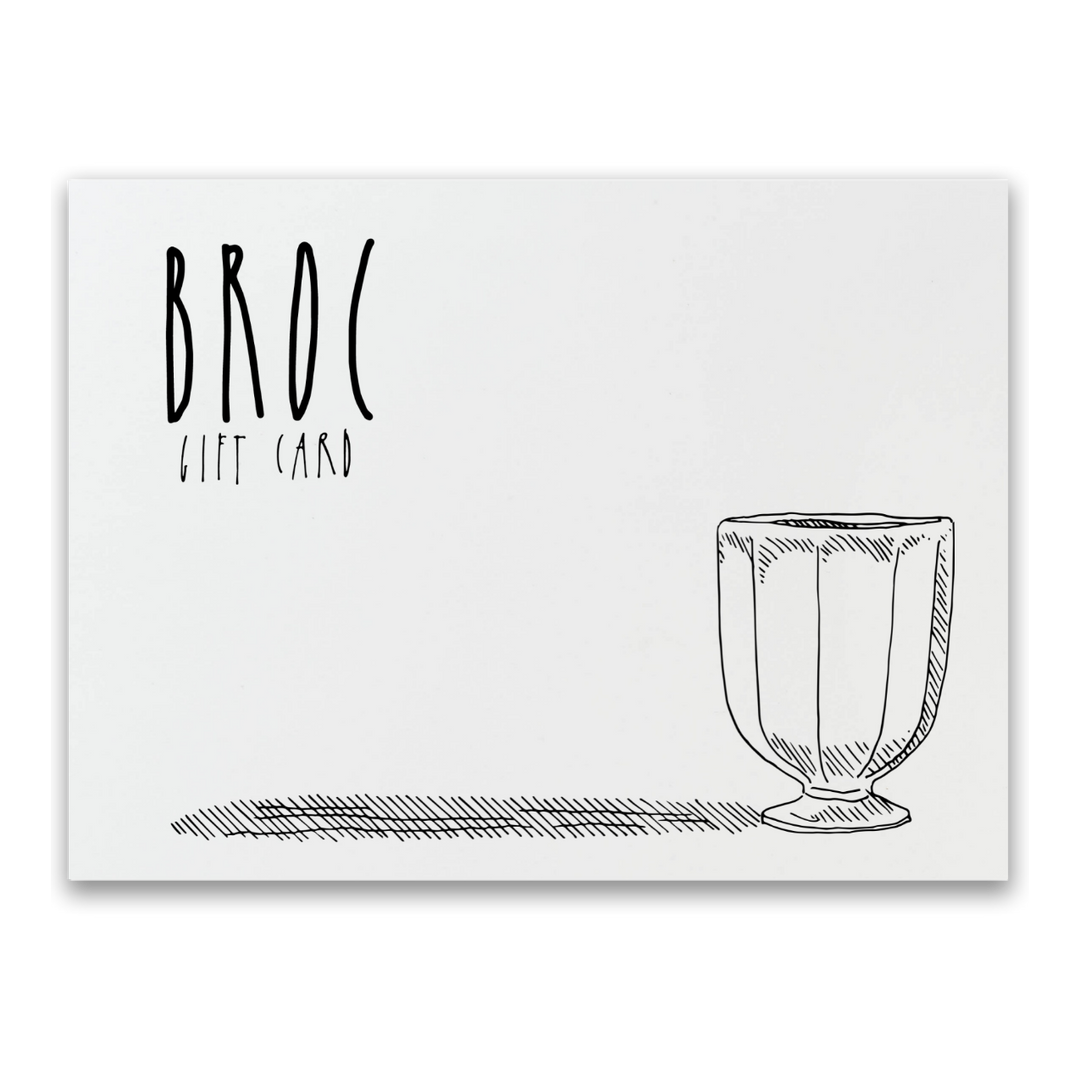 A black and white illustration of the Broc Gift Card from Broc Cellars shows BROC GIFT CARD on the left with a cup drawing on the right. Its minimalistic design against a plain background makes it ideal for any online shop.