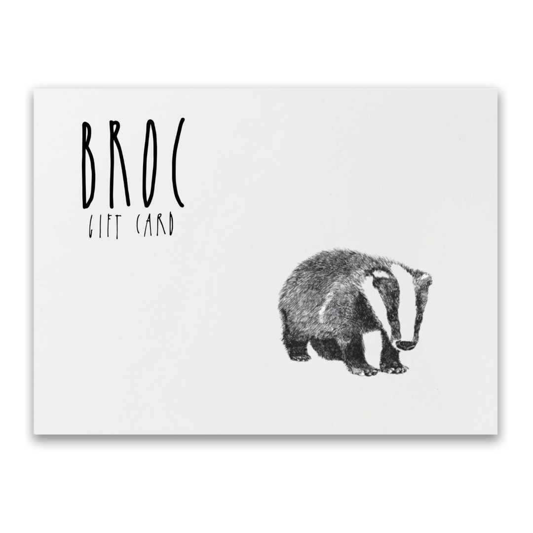The Broc Gift Card by Broc Cellars features a black and white design with a badger illustration on the right and BROC GIFT CARD in bold, stylized font on the left. This digital card, perfect for online shopping fans, has a sleek white background.